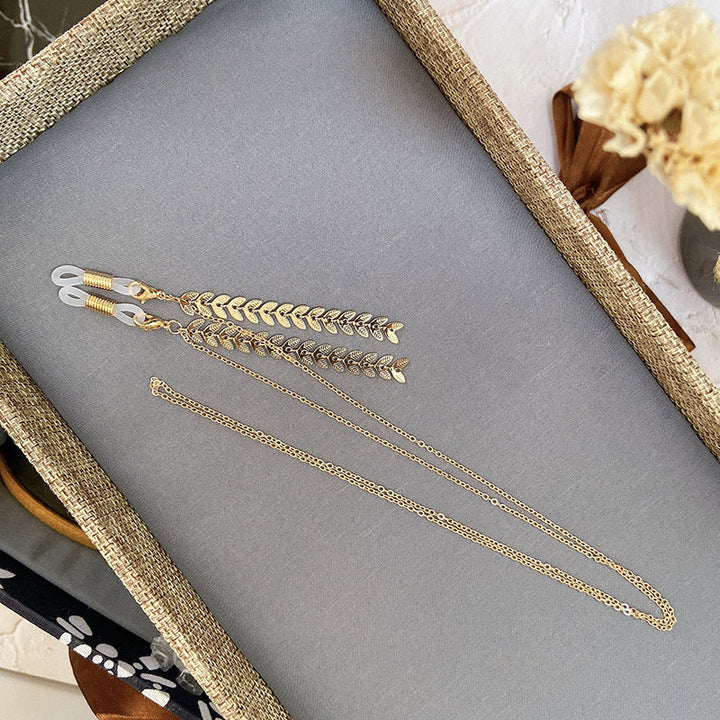 Gorgeous gold leaf drop statement earrings, perfect women's elegant hypoallergenic jewelry accessory.
