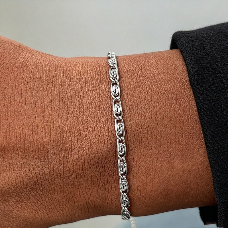 Fashionable gold-tone woven chain bracelet for women, a minimalist and elegant jewelry piece.