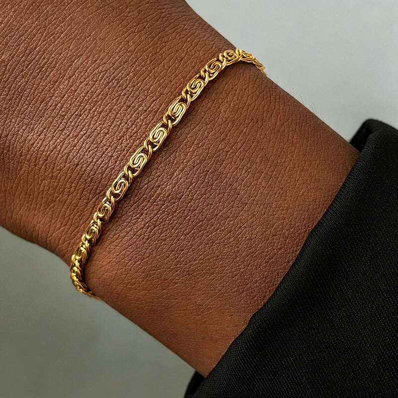 Versatile silver-tone woven chain bracelet, an elegant women's fashion accessory.