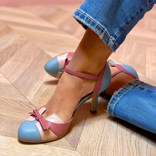 Elegant sky blue orthopedic high heels for women, comfortable stiletto dress shoes.