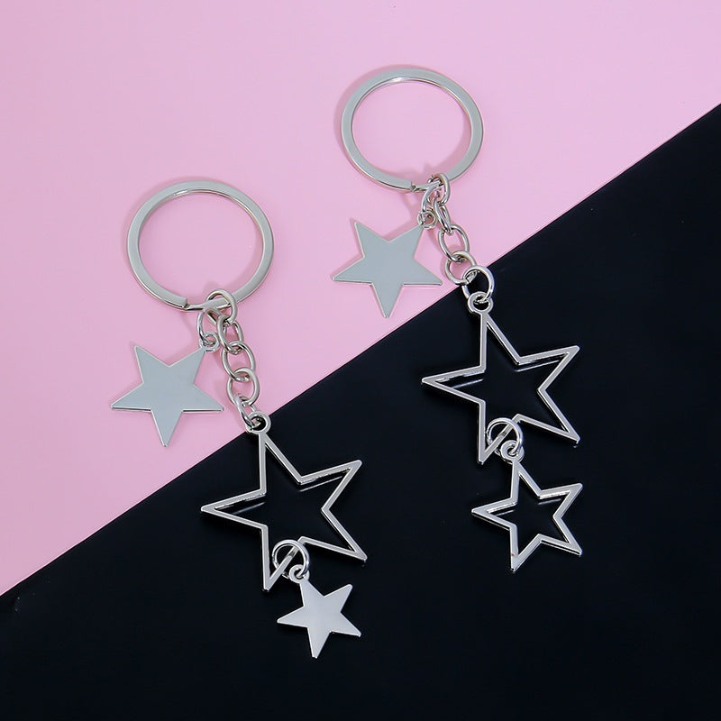 Women's fashion star bag charm. Sparkling metal keychain accessory for keys, purses, or handbags.
