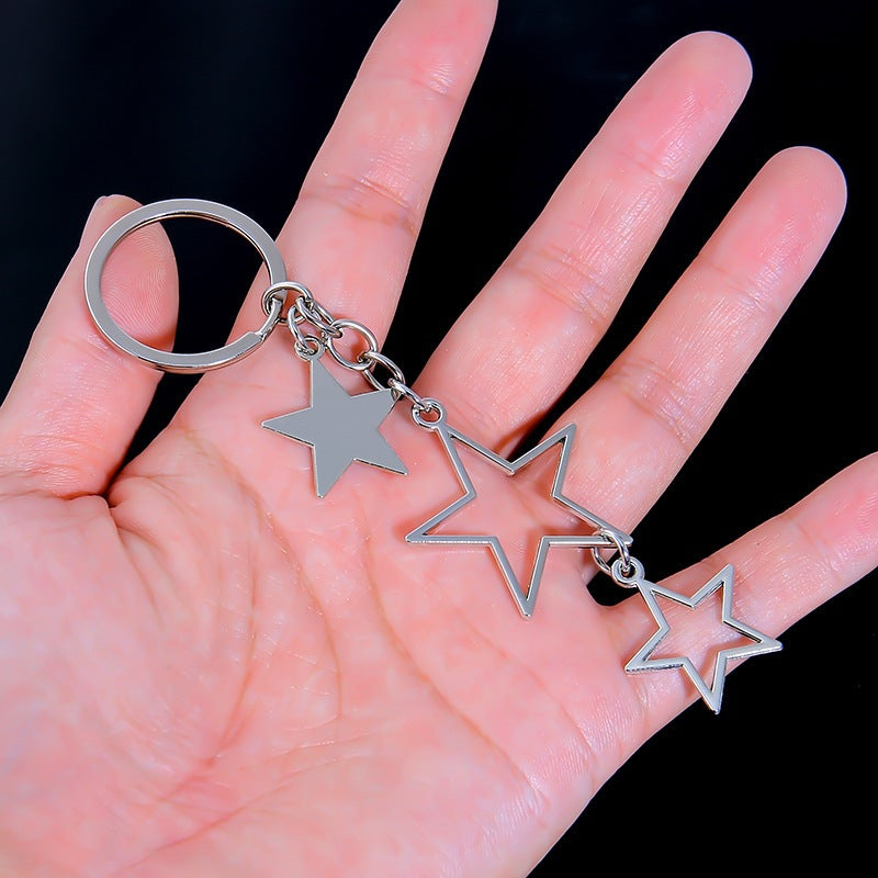 Sparkling star pendant keychain. Elegant women's accessory with crystal embellishments for keys or bags.