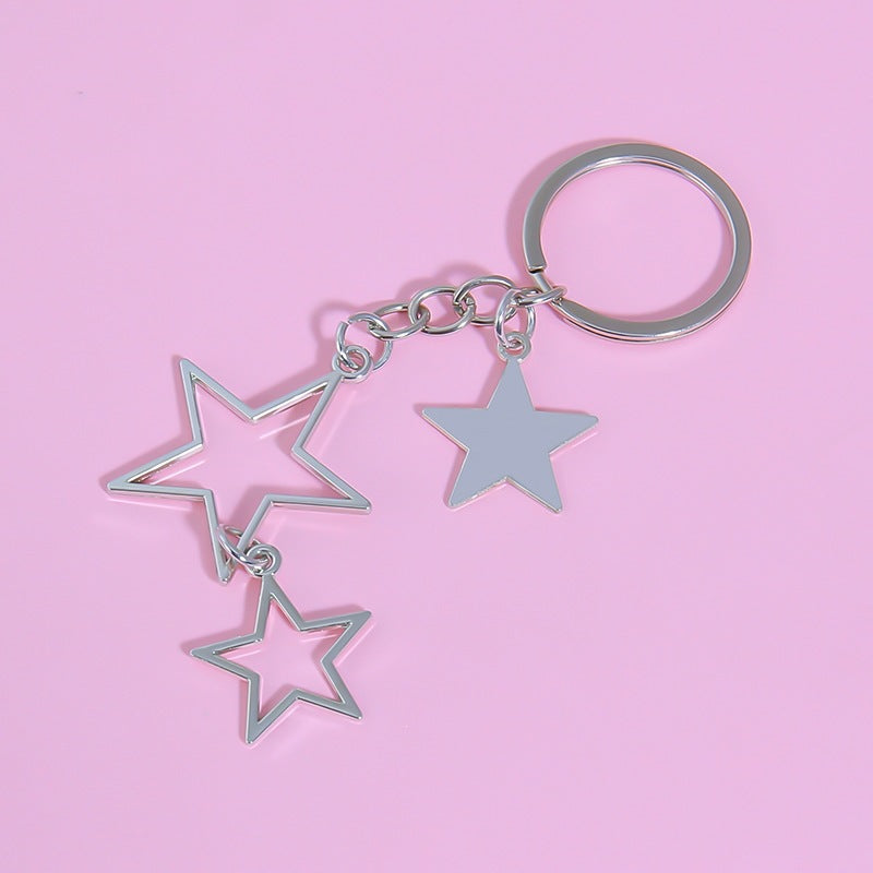 Metal star charm keychain. Dazzling sparkling accessory for women's keys, bags, or as a fashion jewelry accent.