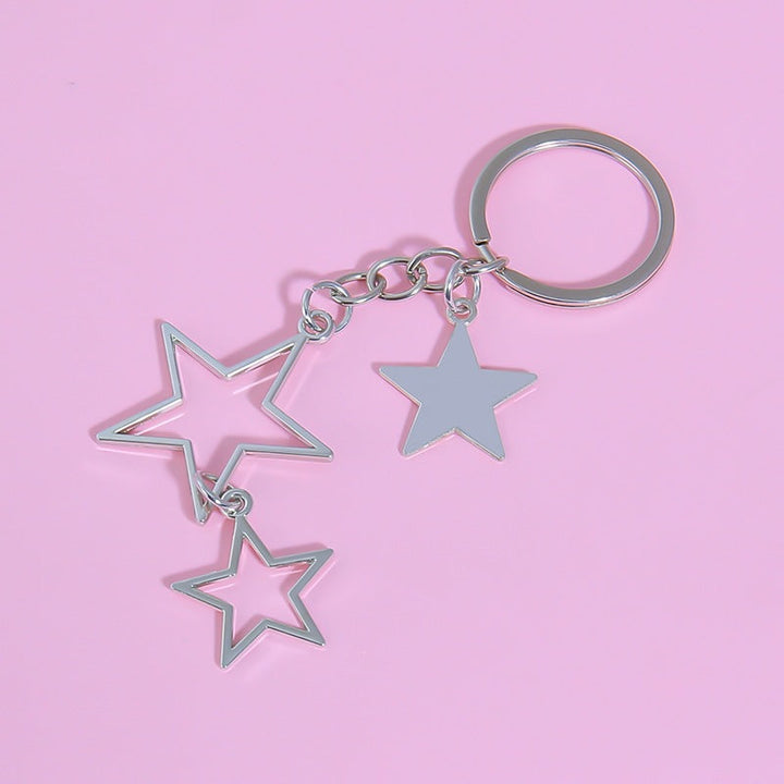 Metal star charm keychain. Dazzling sparkling accessory for women's keys, bags, or as a fashion jewelry accent.