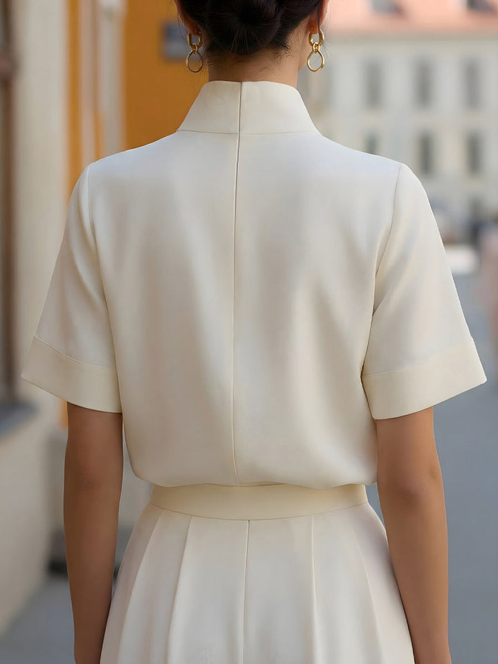 Professional women's short sleeve blouse with stand collar, ideal for business casual & workwear.