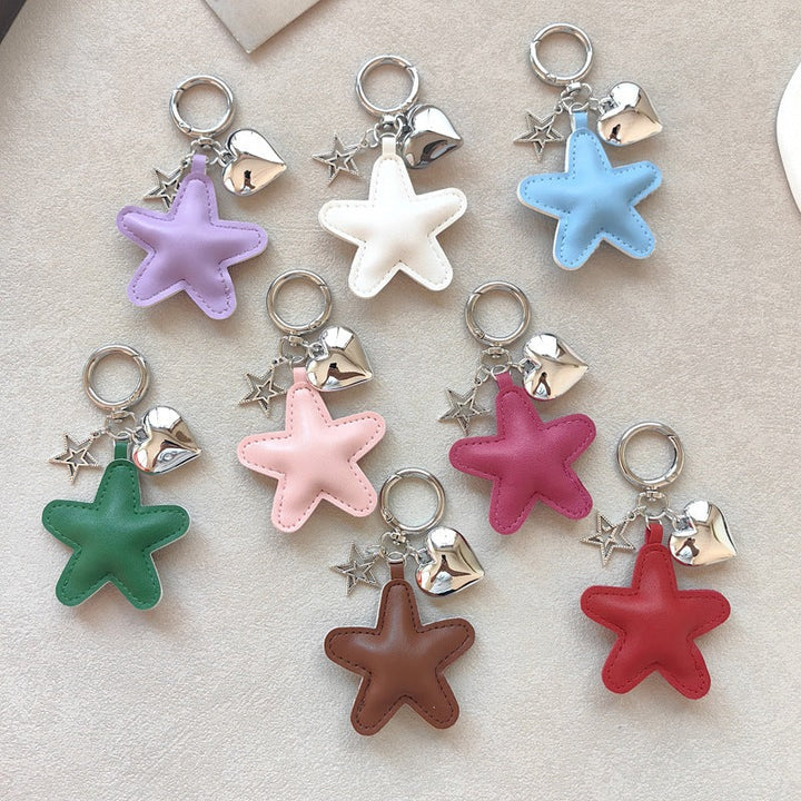 Elegant star & heart keychain charm, a stylish faux leather bag accessory & key holder.