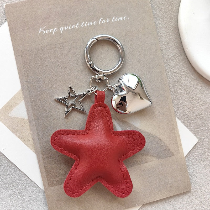 Elegant star & heart charm, perfect as a key holder or a chic decorative accessory for any bag.