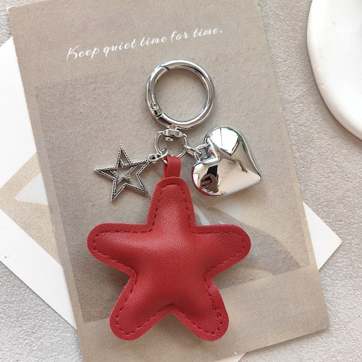 Elegant star & heart charm, perfect as a key holder or a chic decorative accessory for any bag.