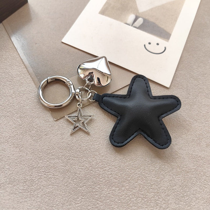 Beautiful star & heart key holder, a charming gift and bag accessory with metal details.