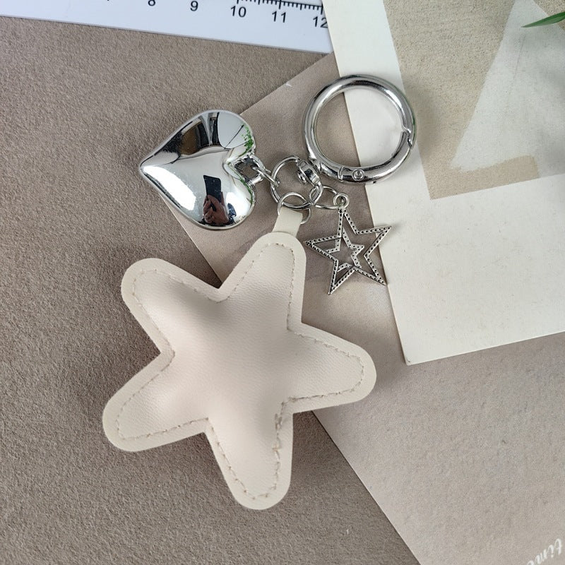 Premium faux leather star & heart design keychain, a unique and decorative bag charm.