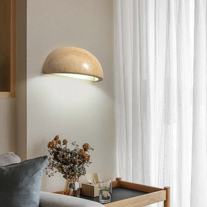 Decorative stone LED wall lamp for modern home decor. Provides warm ambient light, perfect for interior design.