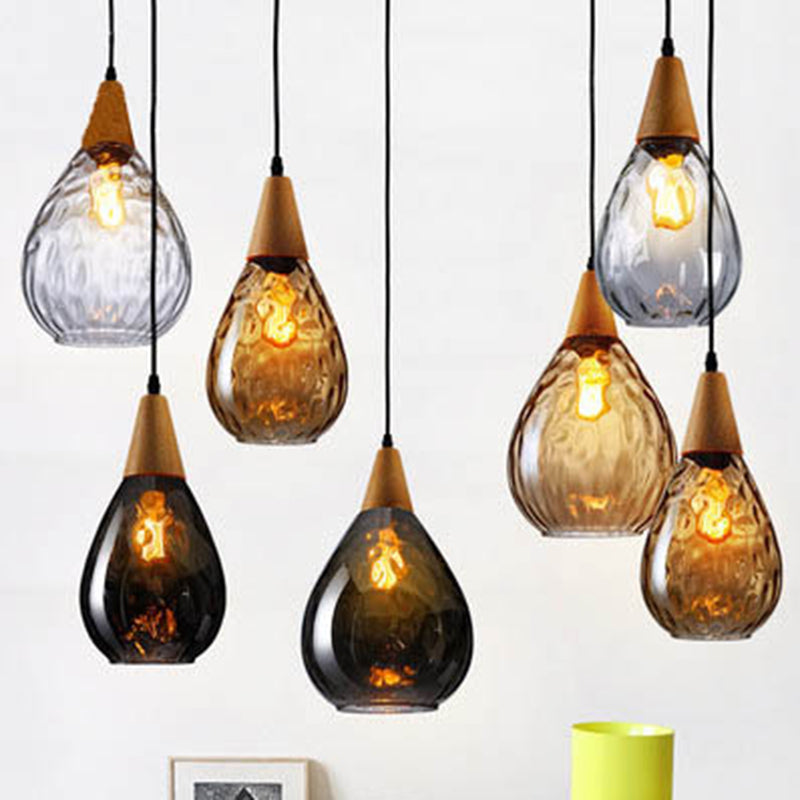 Elegant teardrop glass ceiling lamp, modern home lighting solution with clear design.