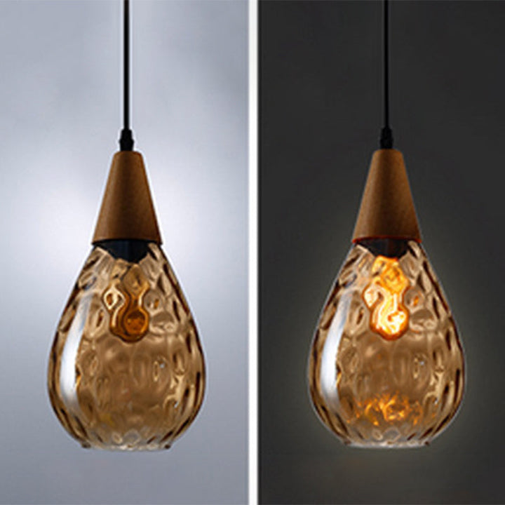 Clear teardrop glass pendant lamp, elegant modern lighting for kitchen island or dining room.