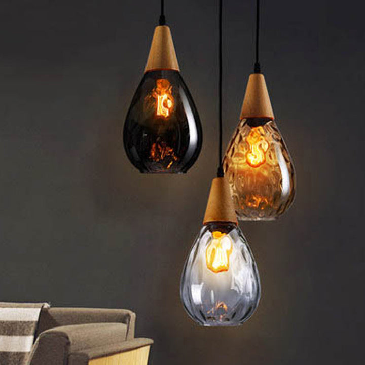 Elegant teardrop glass hanging lamp, sophisticated modern lighting for any home.