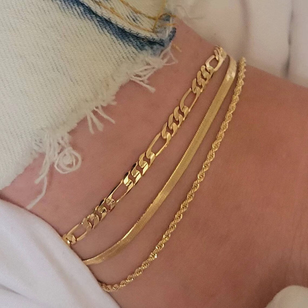 Stylish silver-tone three-strand link bracelet, perfect women's fashion jewelry.