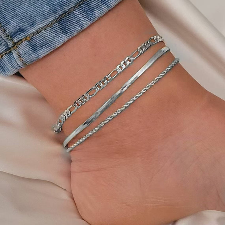 Sophisticated women's three-strand link bracelet, enhancing any outfit with subtle glam.