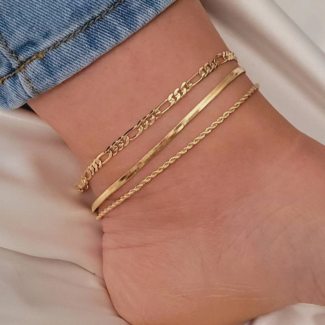 Detailed shot of a delicate three-strand link bracelet, a must-have elegant women's accessory.
