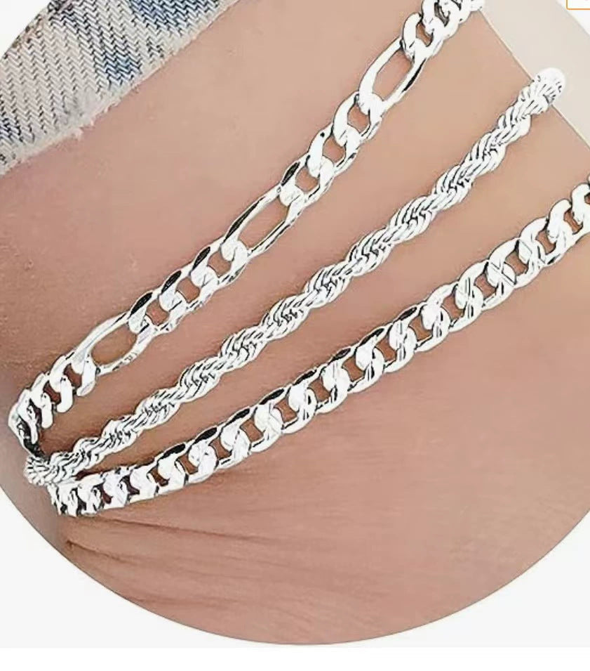 Fashionable women's three-strand link bracelet in silver and gold; elegant jewelry accessory.