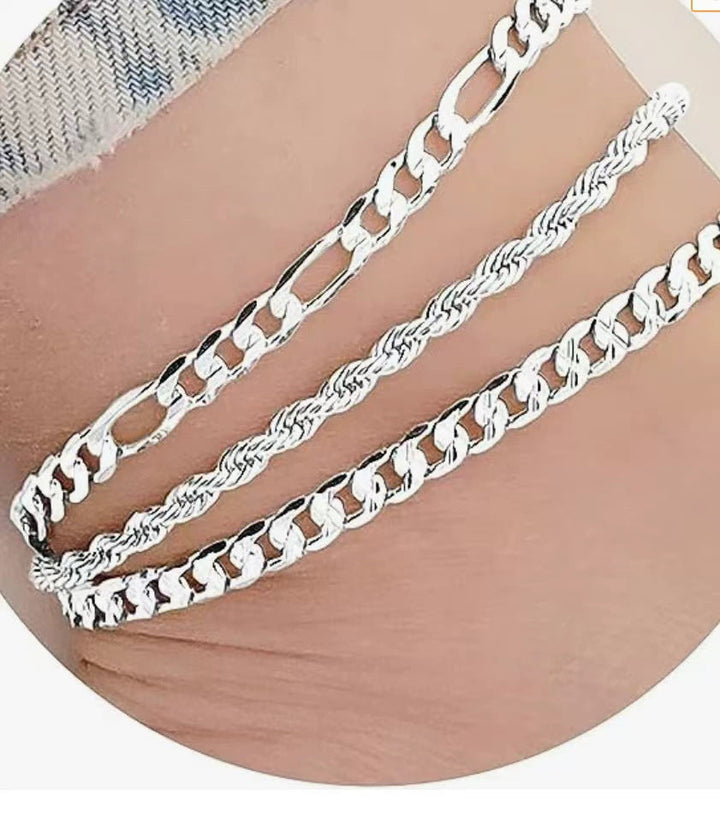 Fashionable women's three-strand link bracelet in silver and gold; elegant jewelry accessory.