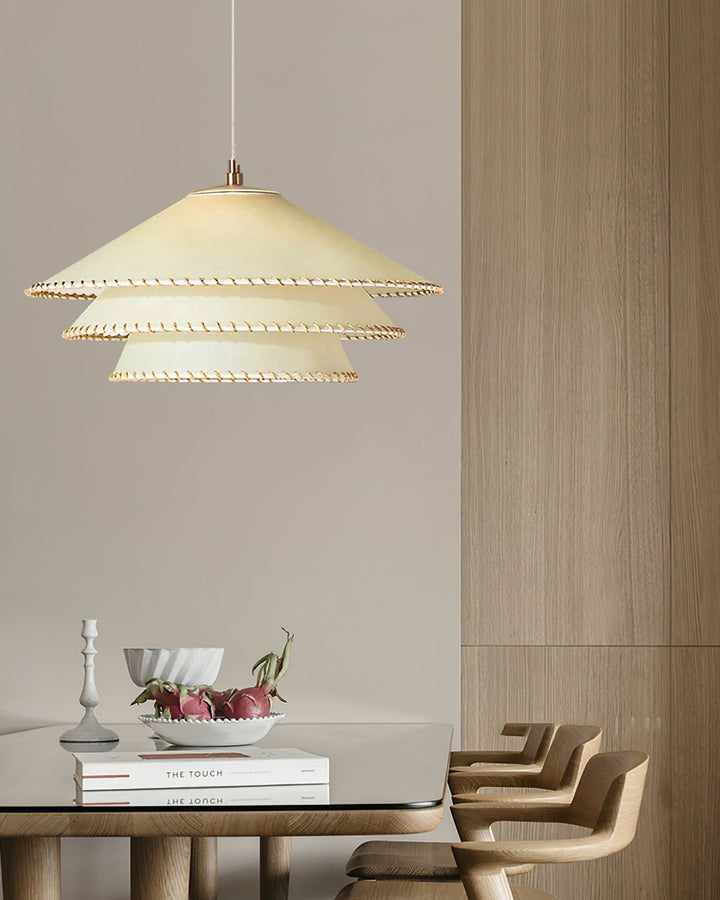 Sculptural tiered pendant light, an artistic ceiling lamp for modern bohemian spaces.
