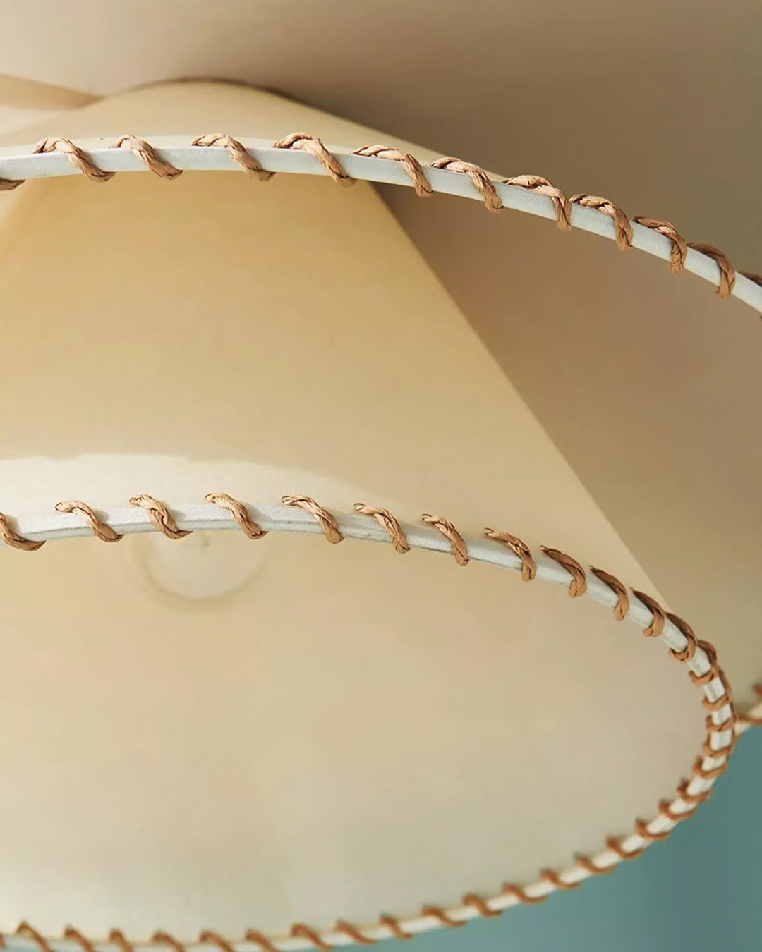 Stylish tiered ceiling pendant, perfect for enhancing modern home decor with warm ambient light.