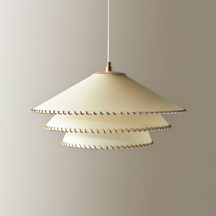 Elegant tiered pendant lamp, casting beautiful ambient light, a perfect modern home decor piece.