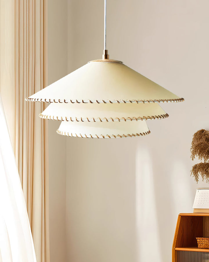 Modern beige tiered pendant lamp, an elegant fixture for ambient home lighting.