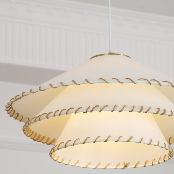 Contemporary tiered pendant light, casting warm ambient light in an elegant space.