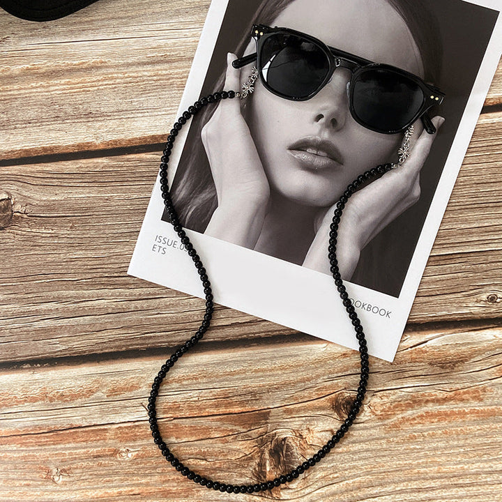 Elegant unisex beaded eyeglass holder chain with intricate design. A stylish and practical accessory to secure your glasses.