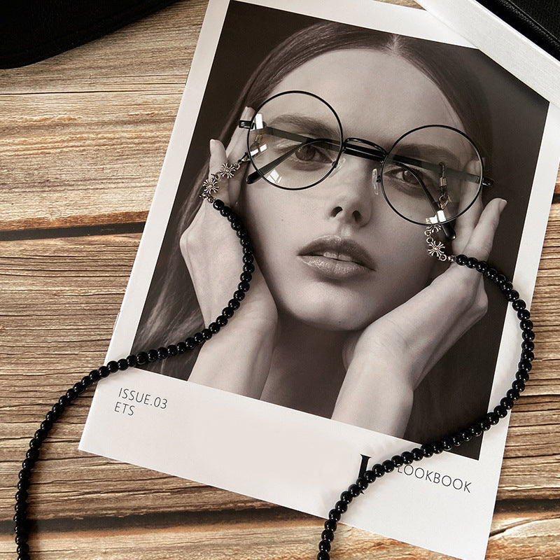 Intricately designed unisex beaded glasses chain, an elegant accessory for fashion eyewear. Secure and versatile.