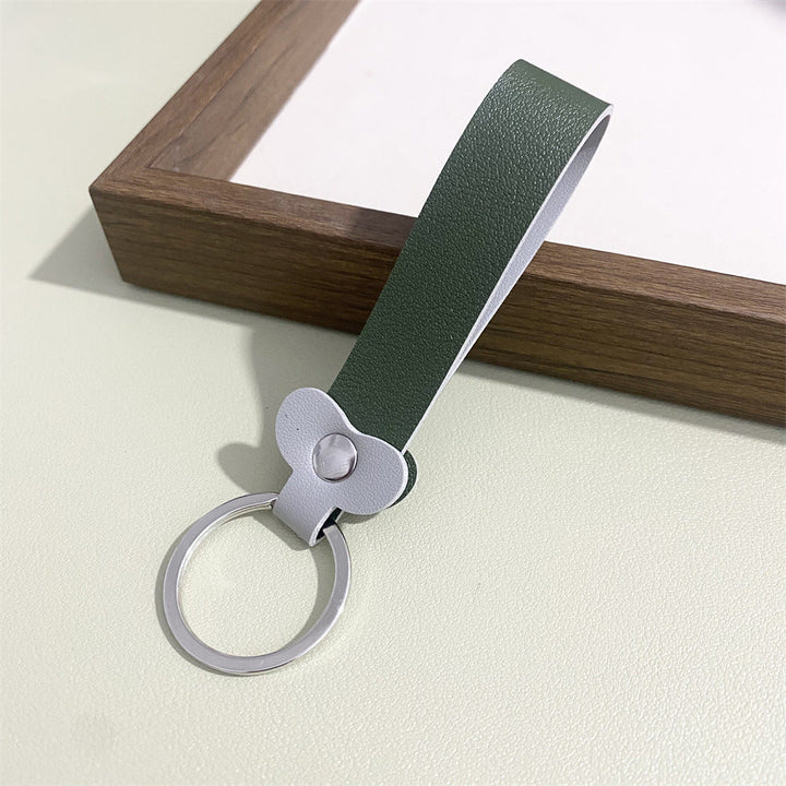 Versatile floral leather key holder, also functions as a charming bag accessory.