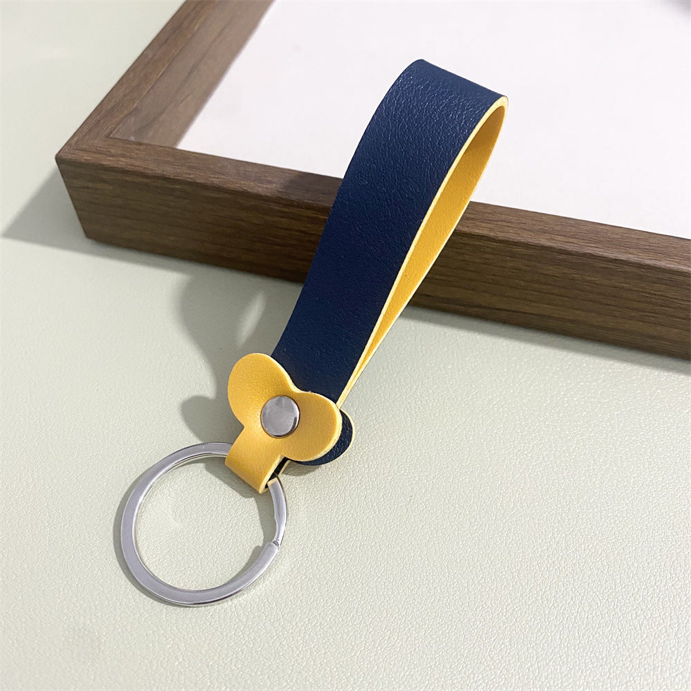 Colorful floral pattern on a chic leather keyring; perfect bag charm.