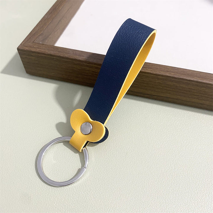 Colorful floral pattern on a chic leather keyring; perfect bag charm.