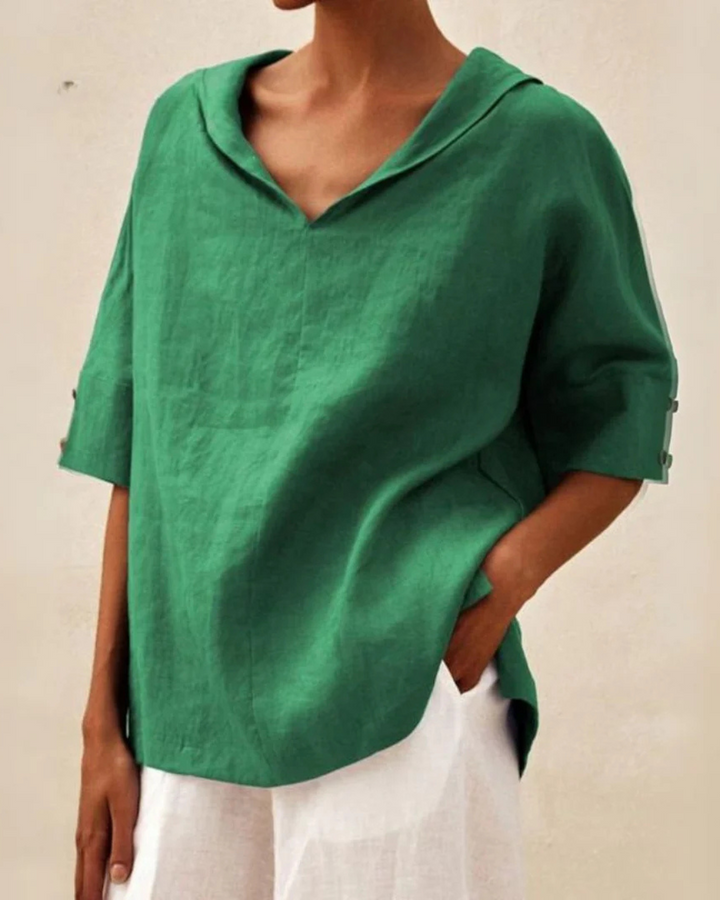 Elegant V-neck half sleeve women's blouse, a versatile top for casual or chic spring/summer styles.