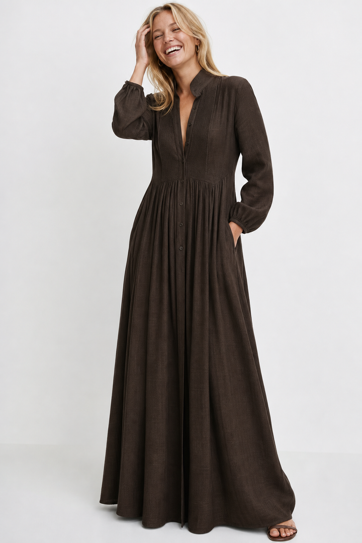 Casual women's maxi dress with V-neck, long balloon sleeves, and practical pockets.