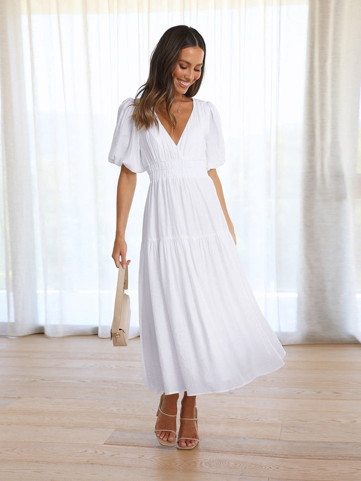 Versatile elegant V-neck midi dress for women, suitable as a cocktail or summer style.