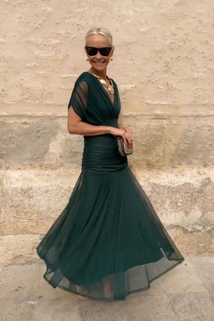 Elegant V-neck maxi dress. Women's party wear, flowy design for special occasion evening events.