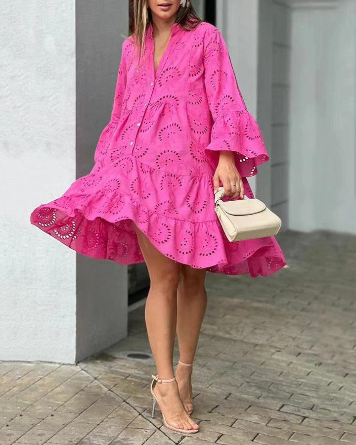 Elegant V-neck tiered mini dress for women, featuring intricate embroidery and bell sleeves.
