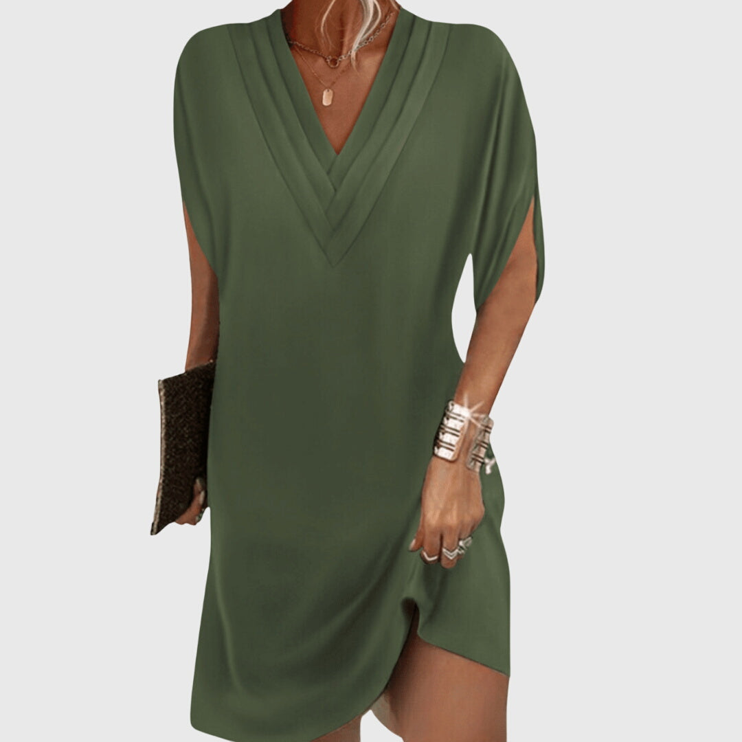 Flattering women's dress with tummy-hiding features, versatile for casual or eveningwear. Comfortable & chic.