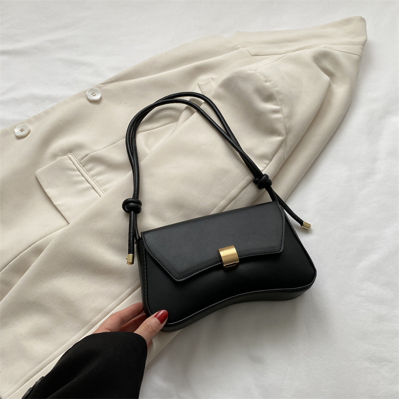 Elegant vintage style women's flap shoulder bag, a chic compact mini crossbody fashion accessory.