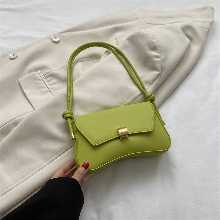 Chic women's vintage mini flap bag, versatile shoulder & crossbody style, an elegant fashion accessory.