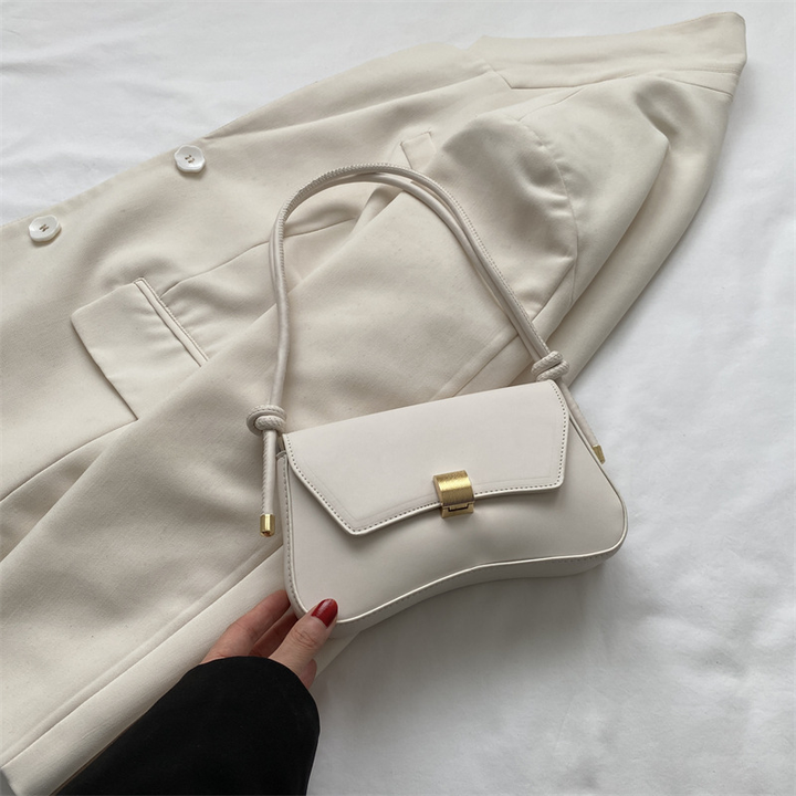 Compact women's vintage style mini flap bag, ideal as an elegant shoulder or crossbody accessory.