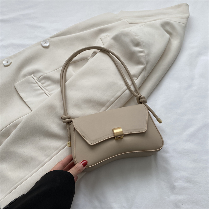Fashionable women's vintage style flap shoulder bag, a refined mini crossbody for elegant outfits.