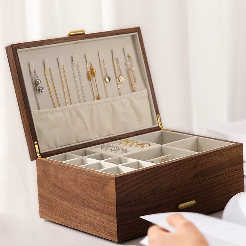 Luxury walnut wood accessory box, designed for elegant storage with soft velvet interior.