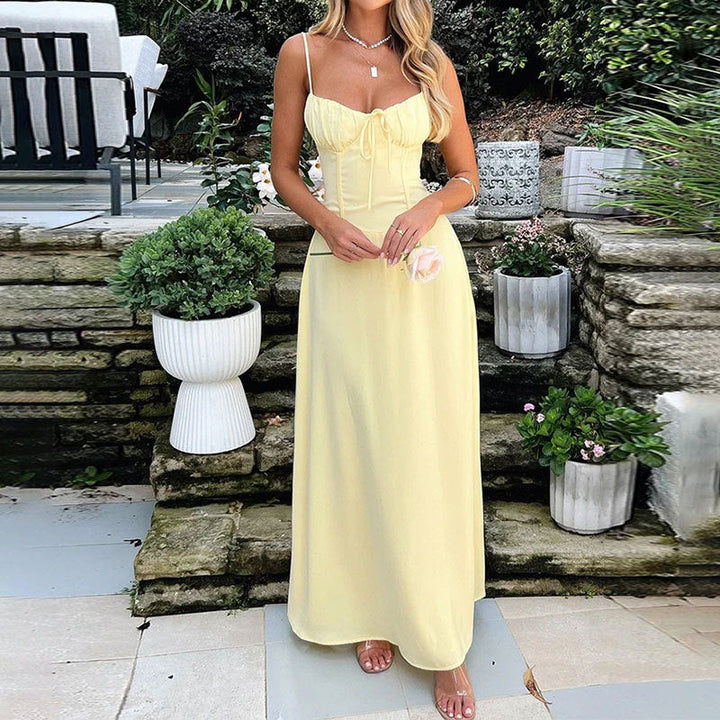 Elegant white A-line maxi dress for women with spaghetti straps & stylish tie-front detail, perfect for summer parties.
