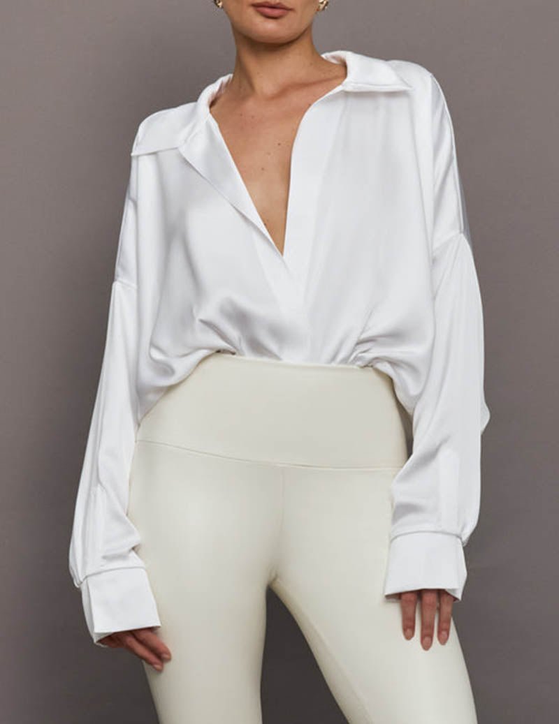 Professional women's collared bodysuit, draped front, long sleeves, suitable for work or smart casual.