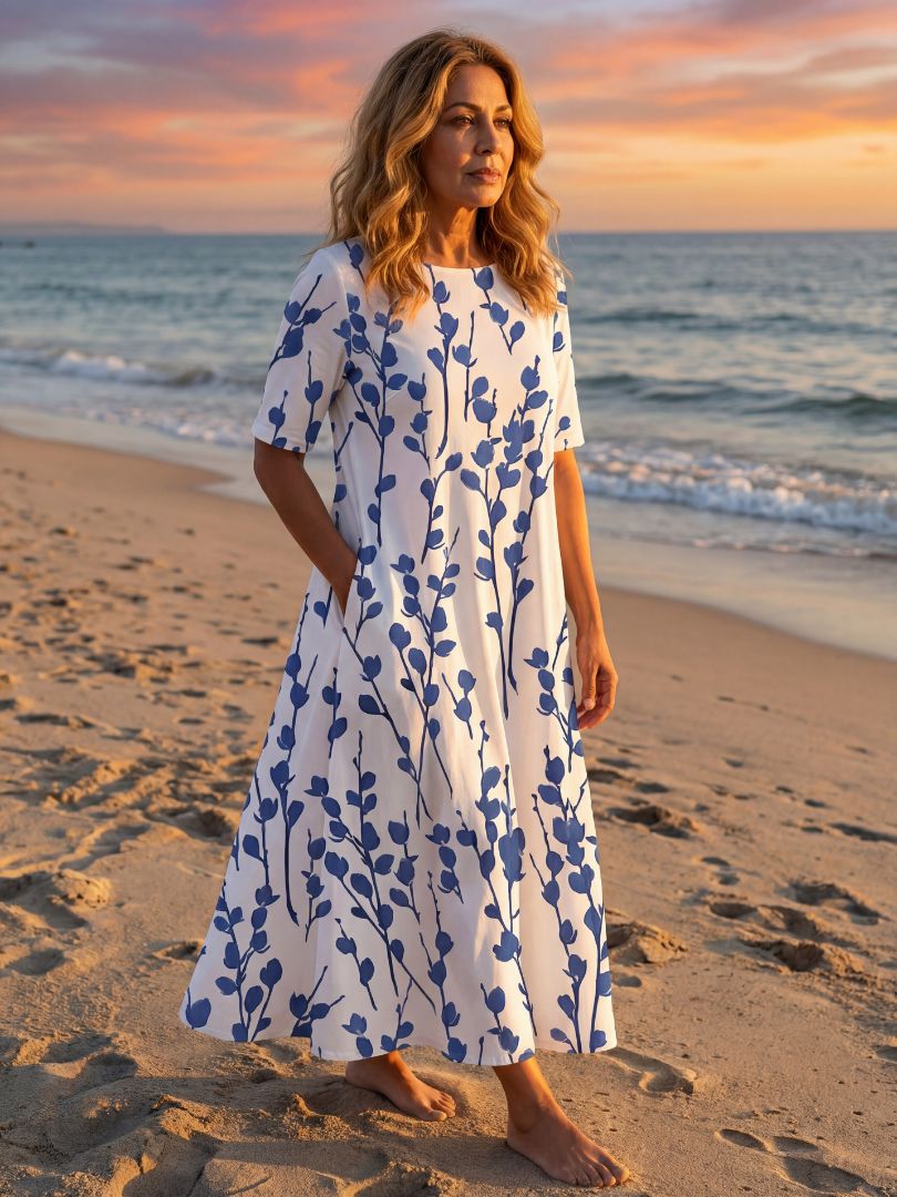 Elegant white floral midi dress for women, A-line cut, short sleeves & practical pockets. Perfect for summer.