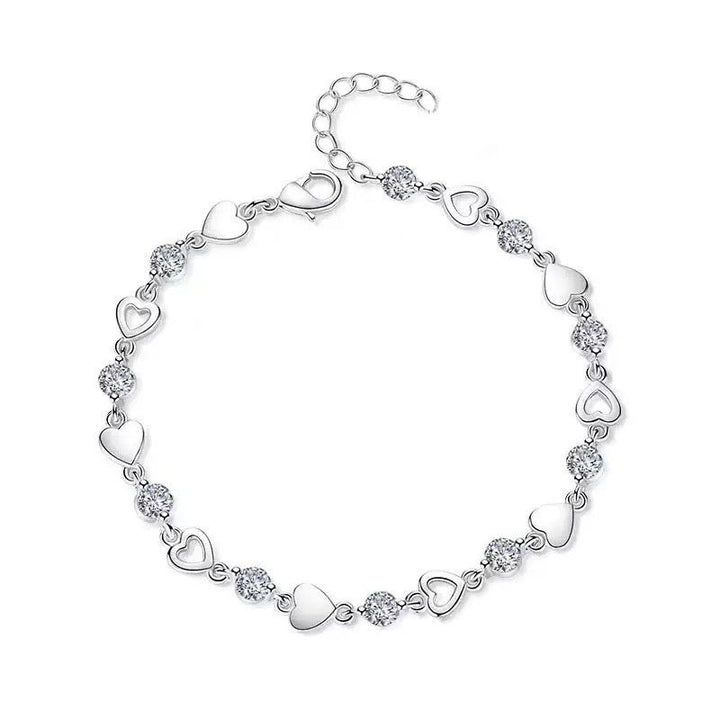 Romantic white & gold heart charm bracelet with crystals. Elegant adjustable jewelry, perfect gift for women.