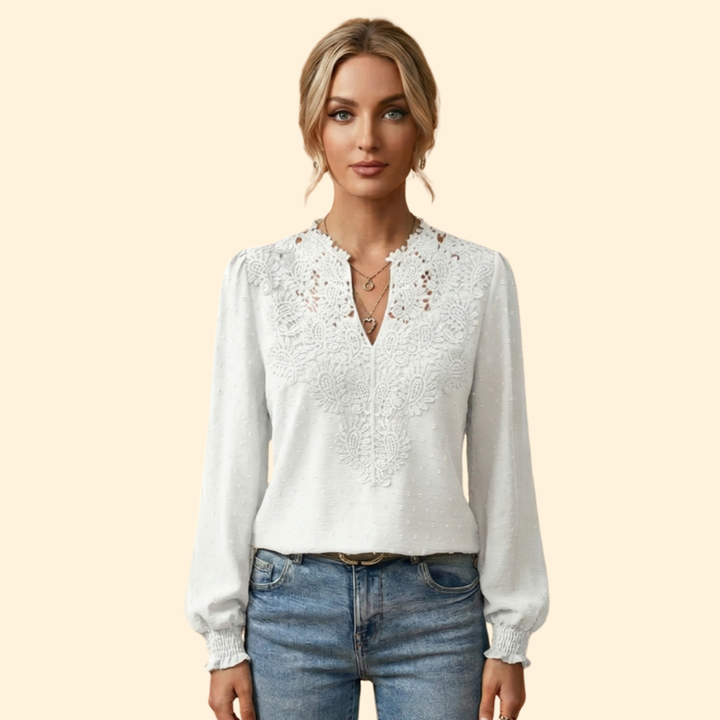 Elegant women's blouse featuring intricate lace and delicate embroidery, a versatile and fashionable wardrobe staple.
