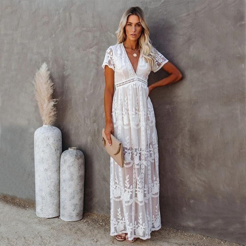 Elegant white lace maxi dress for women, featuring a V-neck and short sleeves, perfect for effortless summer style.